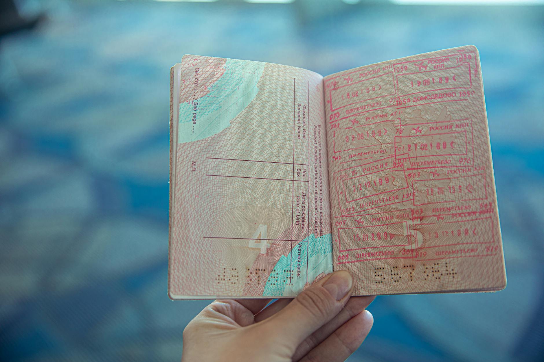 person holding an opened passport
